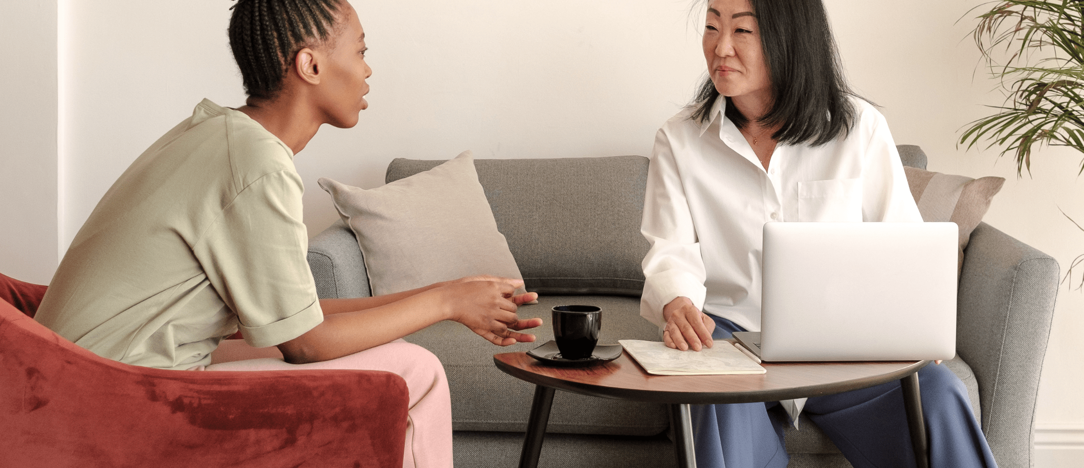 A therapist and client talking in a bright office